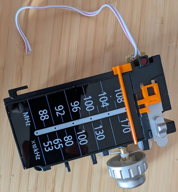 Frequency dial, OFF/FM/AM switch, and power LED